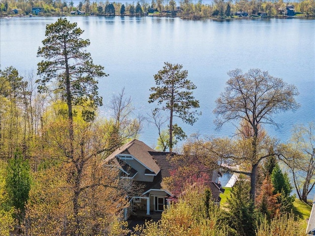 aerial view of property and surrounding area with a large body of water