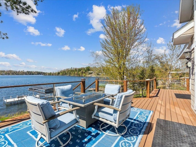 deck featuring a water view