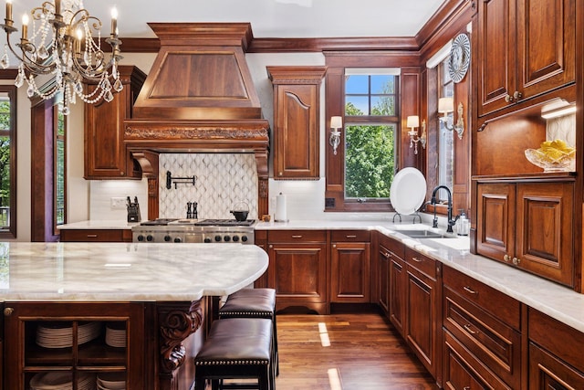 614 Hidden Creek Trl, Mendota Heights, MN 55118 - kitchen with a sink, a chandelier, decorative backsplash, dark wood-type flooring, and ornamental molding