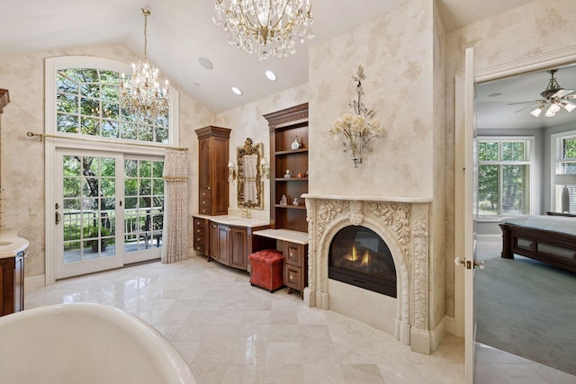 614 Hidden Creek Trl, Mendota Heights, MN 55118 - unfurnished living room with a chandelier, lofted ceiling, healthy amount of natural light, a ceiling fan, and a premium fireplace