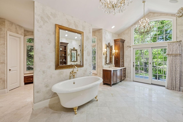 614 Hidden Creek Trl, Mendota Heights, MN 55118 - bathroom featuring a chandelier, lofted ceiling, vanity, a soaking tub, and baseboards