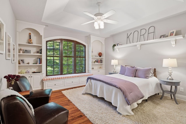 614 Hidden Creek Trl, Mendota Heights, MN 55118 - bedroom with wood finished floors, a ceiling fan, and a tray ceiling