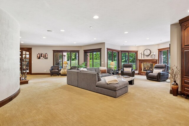 614 Hidden Creek Trl, Mendota Heights, MN 55118 - living room featuring light carpet, recessed lighting, baseboards, and a glass covered fireplace