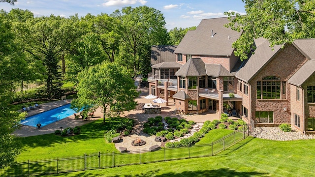 614 Hidden Creek Trl, Mendota Heights, MN 55118 - back of property with a patio area, an outdoor fire pit, a balcony, and brick siding
