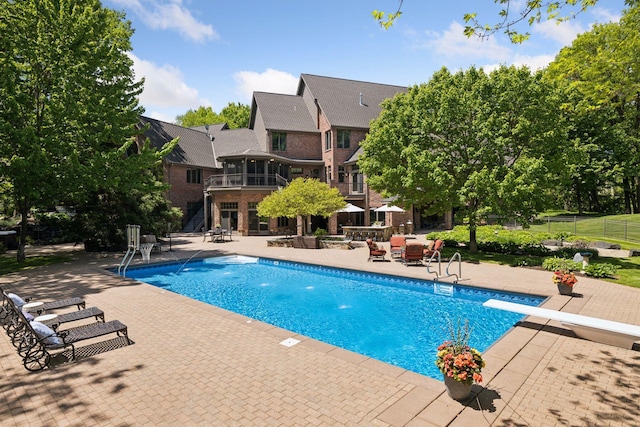 614 Hidden Creek Trl, Mendota Heights, MN 55118 - swimming pool featuring a patio area, a diving board, and stairs
