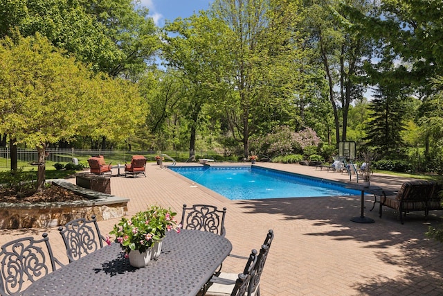 614 Hidden Creek Trl, Mendota Heights, MN 55118 - view of swimming pool with a patio, outdoor dining space, and view of wooded area
