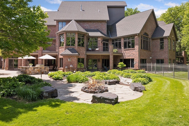 614 Hidden Creek Trl, Mendota Heights, MN 55118 - back of property with a patio, an outdoor fire pit, and brick siding
