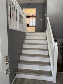 1415 Trailwood Ln SW, Faribault, MN 55021 - staircase with wood finished floors and baseboards