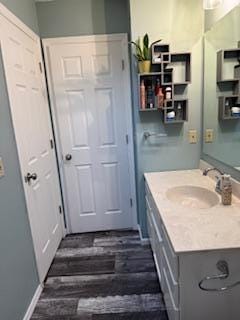 1415 Trailwood Ln SW, Faribault, MN 55021 - bathroom featuring vanity and wood finished floors