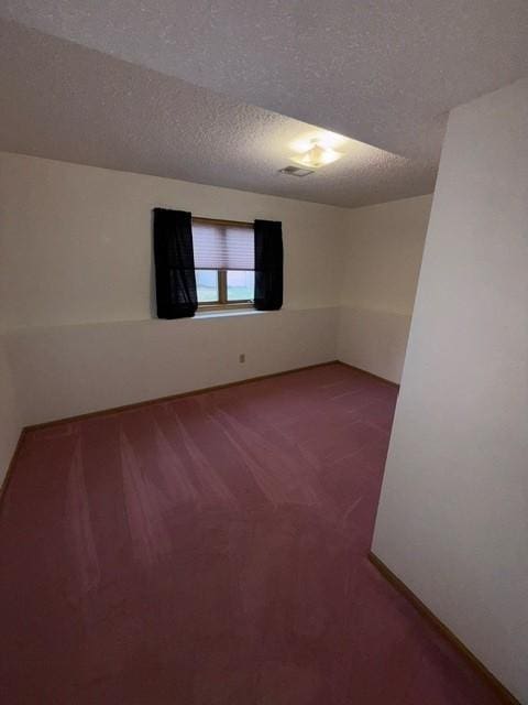 1415 Trailwood Ln SW, Faribault, MN 55021 - spare room with carpet floors and a textured ceiling