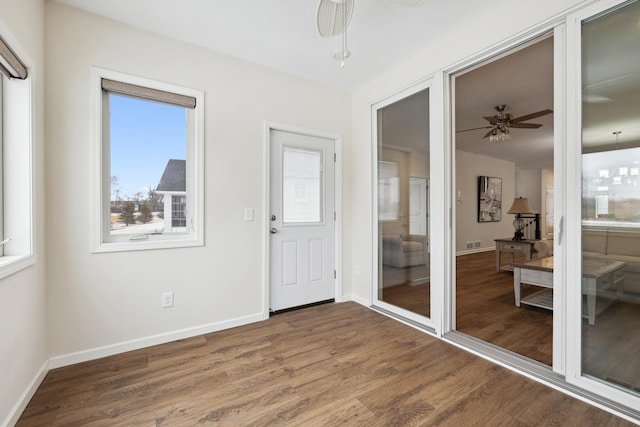 17865 Graphite Ln, Lakeville, MN 55044 - doorway featuring visible vents, baseboards, wood finished floors, and ceiling fan