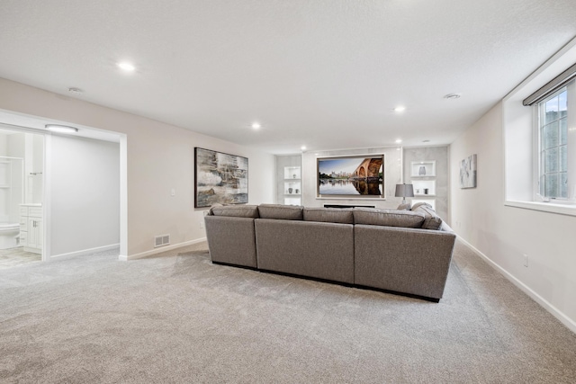 17865 Graphite Ln, Lakeville, MN 55044 - living room featuring light colored carpet, baseboards, visible vents, and recessed lighting
