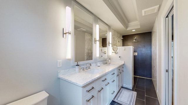 bathroom with a sink, tile patterned floors, walk in shower, and visible vents