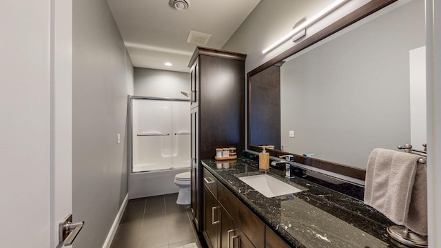 full bathroom featuring vanity, tile patterned flooring, toilet, baseboards, and bath / shower combo with glass door