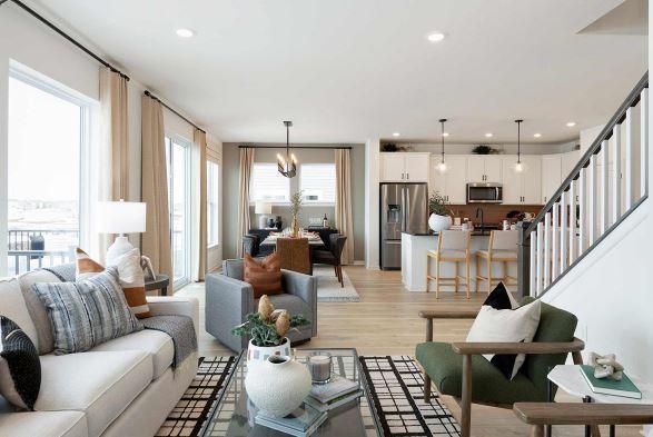 living room with stairway, a notable chandelier, light wood-style floors, and recessed lighting