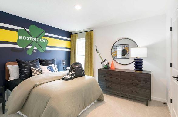 carpeted bedroom featuring baseboards