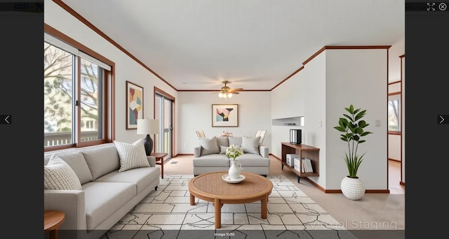 607 Belland Ave, Vadnais Heights, MN 55127 - living area featuring crown molding, ceiling fan, and baseboards