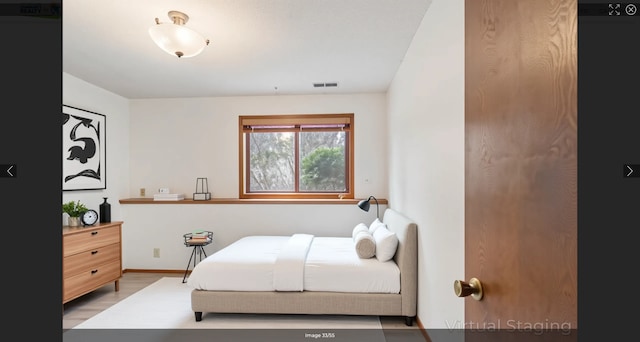 607 Belland Ave, Vadnais Heights, MN 55127 - bedroom featuring wood finished floors
