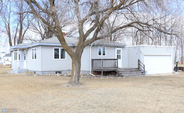 101 Mckenzie Ave, Strathcona, MN 56759 - view of front of home with an attached garage, a wooden deck, a chimney, and a front yard