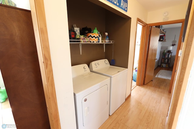 101 Mckenzie Ave, Strathcona, MN 56759 - clothes washing area featuring washing machine and dryer, light wood finished floors, and laundry area