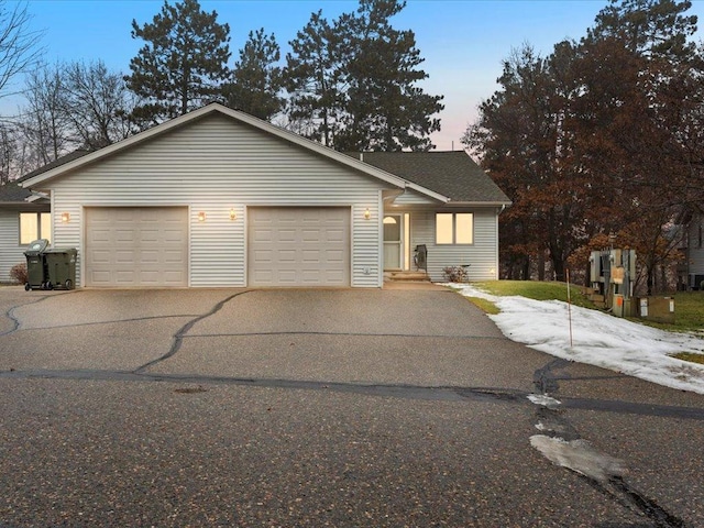 view of front of property with driveway and a garage