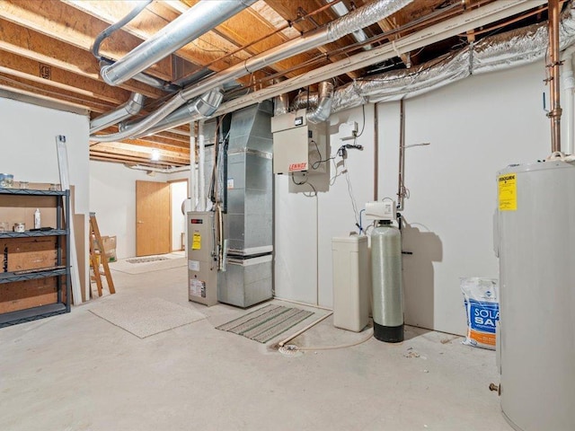 unfinished below grade area featuring heating unit and electric water heater