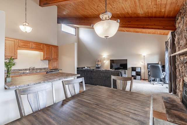 8372 Lower 138th Ct, Apple Valley, MN 55124 - kitchen with high vaulted ceiling, a wooden ceiling with exposed beams, a peninsula, pendant lighting, and light wood-style flooring
