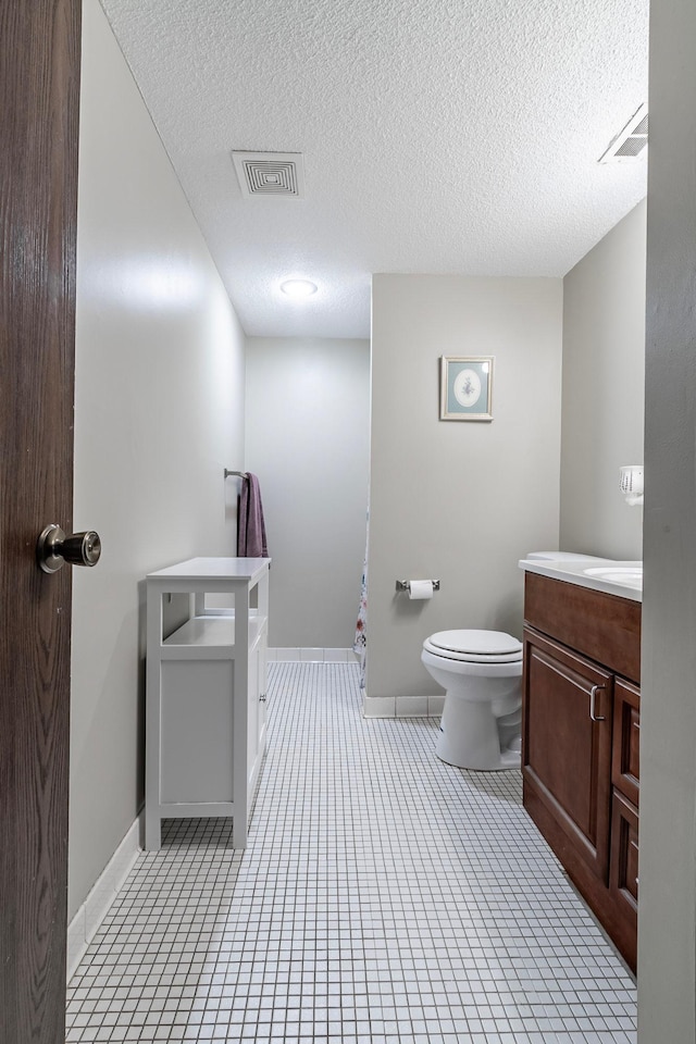 8372 Lower 138th Ct, Apple Valley, MN 55124 - bathroom featuring vanity, a textured ceiling, and tile patterned flooring