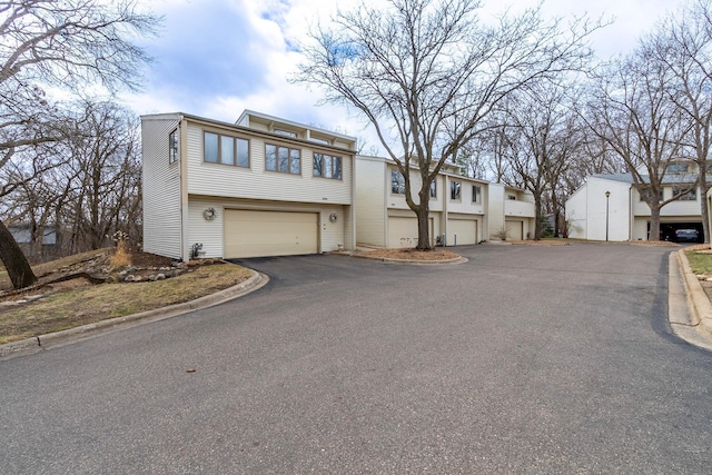 8372 Lower 138th Ct, Apple Valley, MN 55124 - view of front facade featuring a garage and asphalt driveway