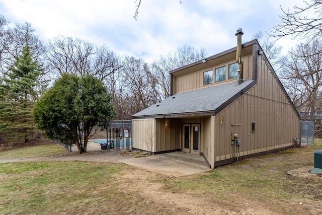8372 Lower 138th Ct, Apple Valley, MN 55124 - back of house with a shingled roof and a patio area
