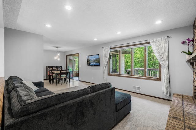 805 Ithaca Ln N, Plymouth, MN 55447 - living area featuring recessed lighting, plenty of natural light, a textured ceiling, baseboards, and a chandelier