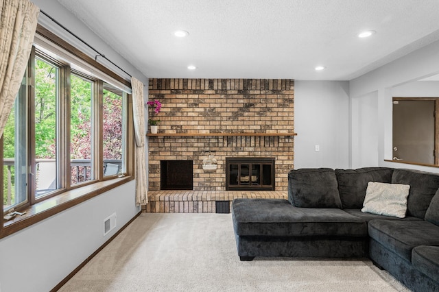 805 Ithaca Ln N, Plymouth, MN 55447 - living area with a fireplace, carpet floors, recessed lighting, and a textured ceiling
