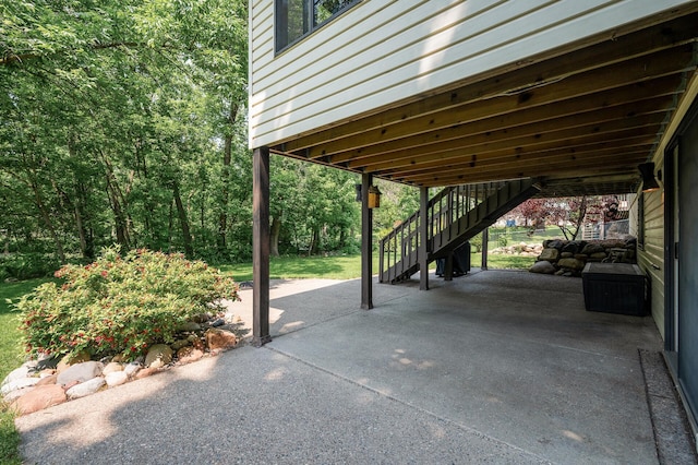 805 Ithaca Ln N, Plymouth, MN 55447 - view of patio featuring stairway and a carport