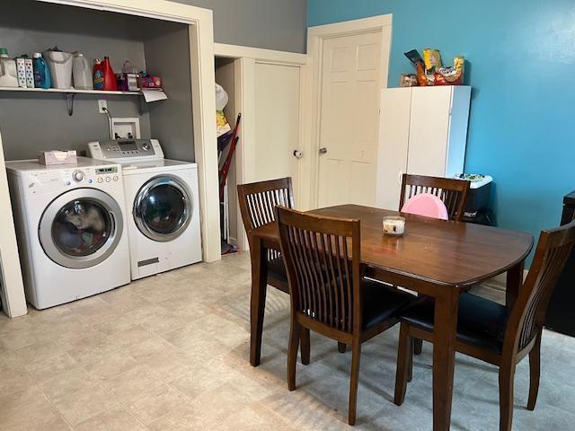 laundry room featuring washing machine and clothes dryer and laundry area