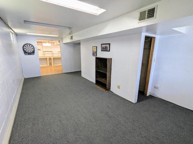 46167 Jefferson Lake Dr, Cleveland Twp, MN 56017 - below grade area with visible vents, carpet flooring, and concrete block wall