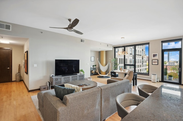 1240 2nd St Unit 526, Minneapolis, MN 55415 - living area with a ceiling fan, visible vents, and light wood-style floors