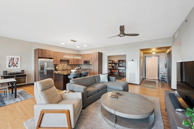 1240 2nd St Unit 526, Minneapolis, MN 55415 - living room featuring recessed lighting, visible vents, ceiling fan, and light wood-type flooring