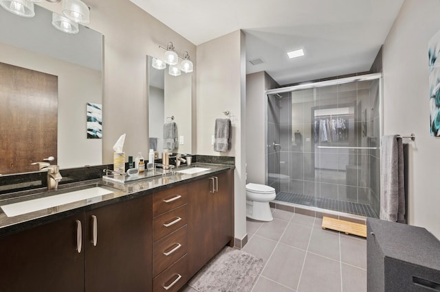 1240 2nd St Unit 526, Minneapolis, MN 55415 - full bathroom with a shower stall, toilet, double vanity, and a sink