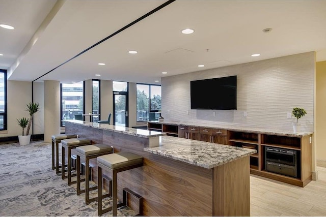 1240 2nd St Unit 526, Minneapolis, MN 55415 - bar with recessed lighting, backsplash, and floor to ceiling windows