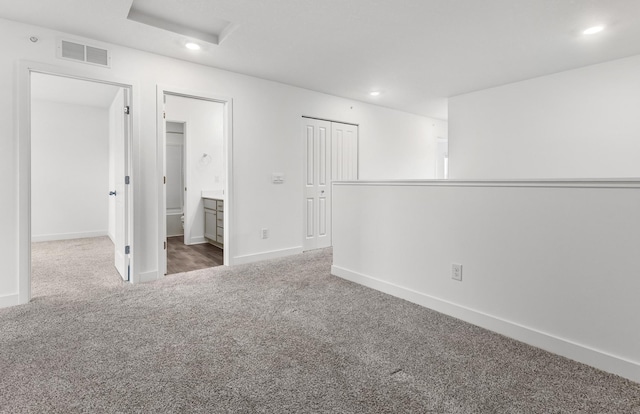 unfurnished bedroom with baseboards, recessed lighting, visible vents, and carpet