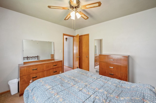 carpeted bedroom with ceiling fan and visible vents
