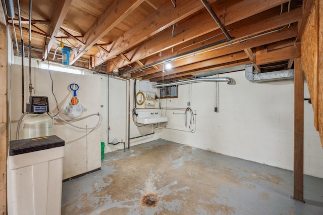 unfinished basement featuring a sink