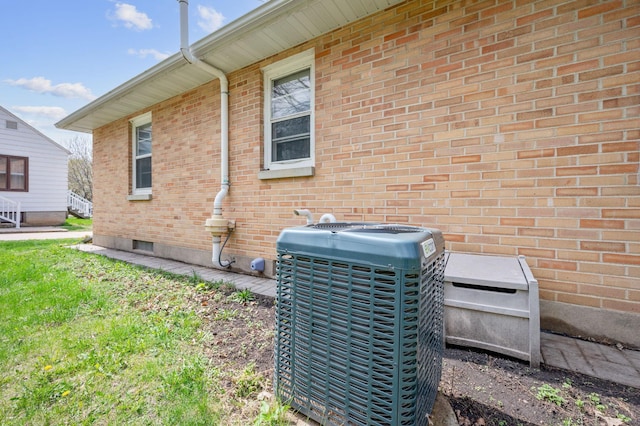 details with cooling unit and brick siding
