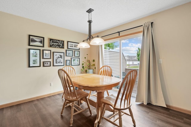11215 16th St NE, Saint Michael, MN 55376 - dining area with dark wood-style floors, baseboards, and a textured ceiling