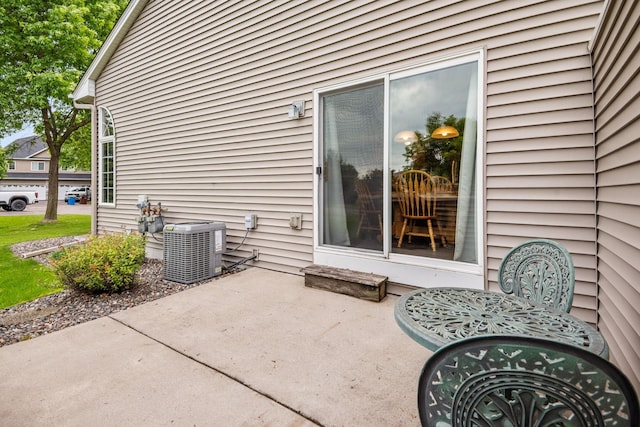 11215 16th St NE, Saint Michael, MN 55376 - view of patio featuring central AC unit