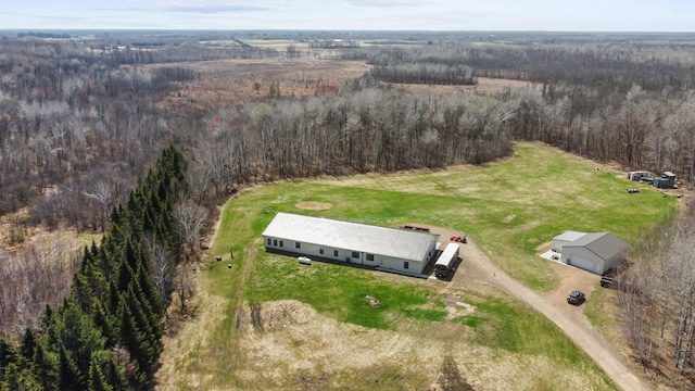 bird's eye view with a wooded view