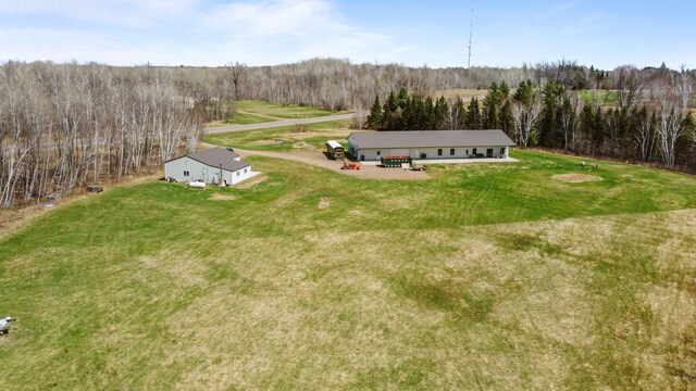 bird's eye view featuring a wooded view