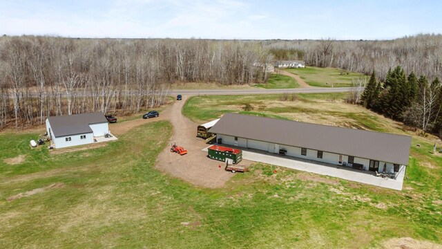 aerial view featuring a wooded view