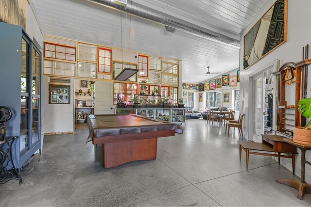 recreation room with concrete floors, ceiling fan, pool table, and a healthy amount of sunlight
