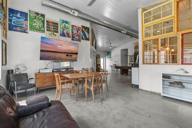 dining room with finished concrete floors and visible vents